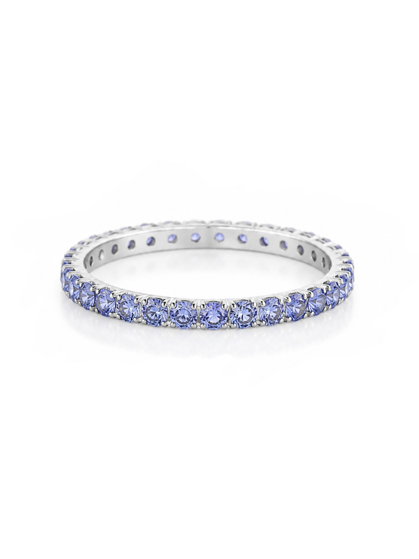 White gold eternity band ring set with round tanzanite gemstones