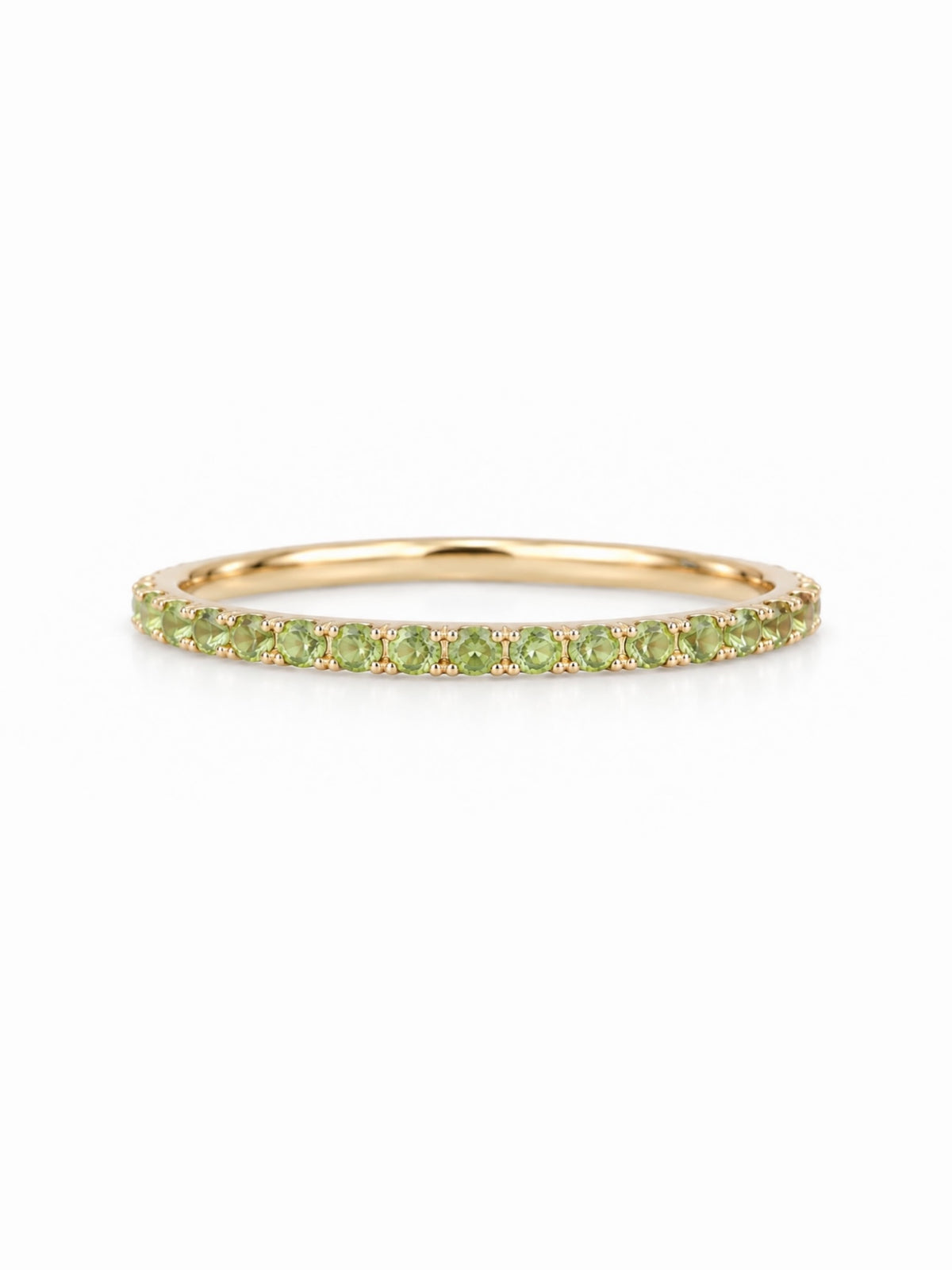 Natural peridot pavé eternity ring in yellow gold, slim stacking band with continuous lime green stones